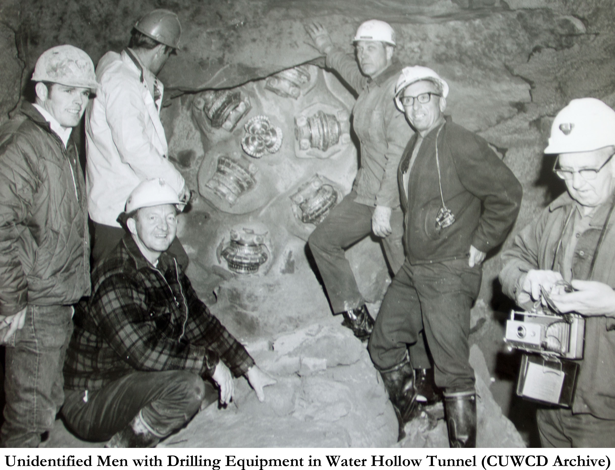 Unidentified Men with Drilling Equipment in Water Hollow Tunnel